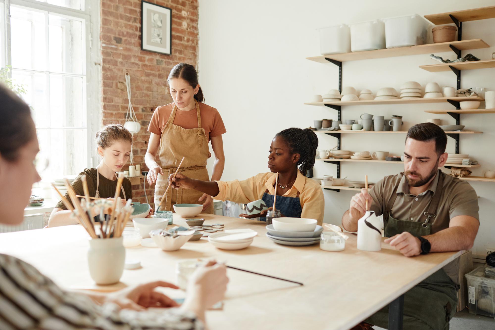 Small group tasting at long wooden table